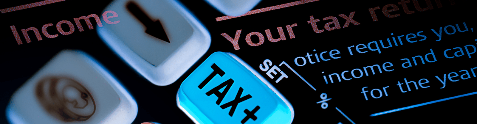 Digital tax return concept with 'TAX+' key highlighted, symbolizing income tax processing and IRS filing