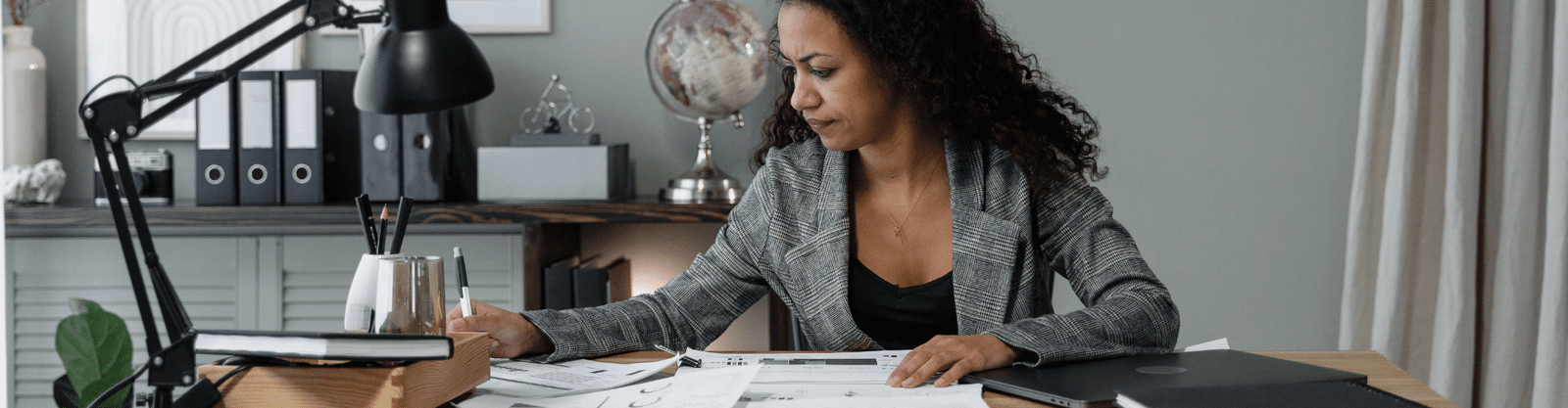 Stressed business owner working on documents related to ERC filings.